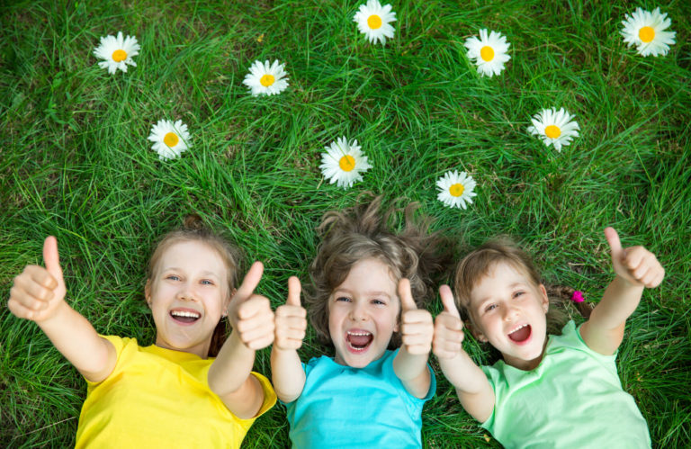 Confident child smiling after a fun salon pamper session at StarKids