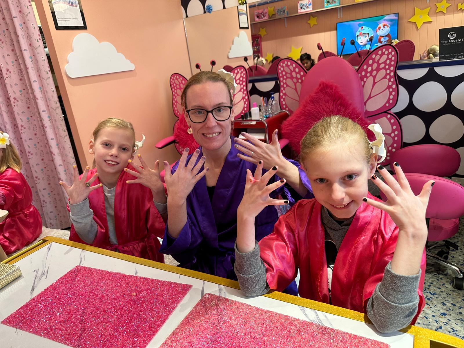 Mum and daughter showing their manicures